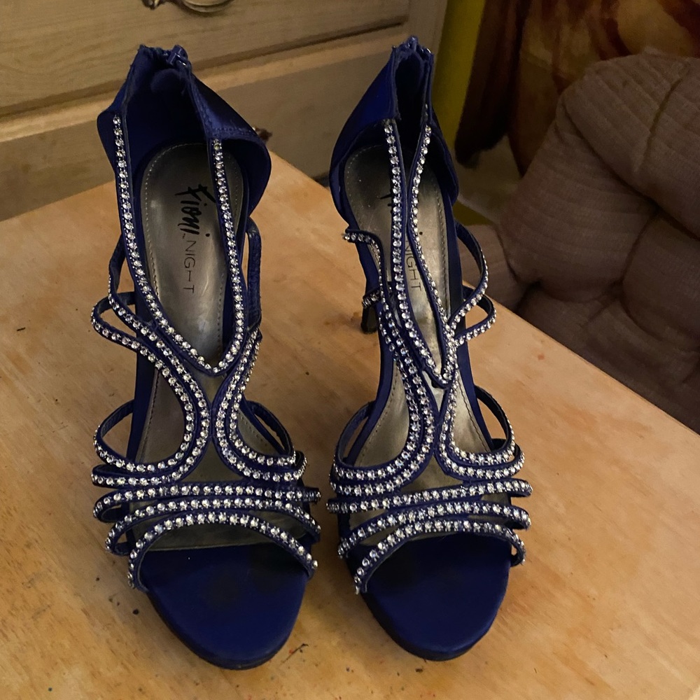 Size 8, purple almost dark blue heels.